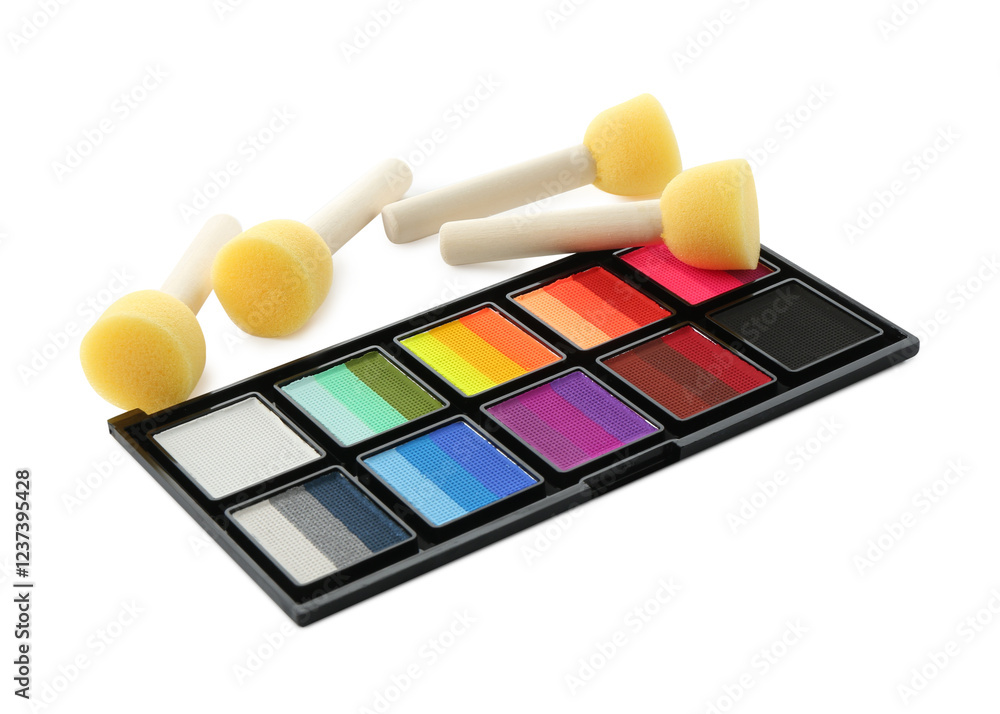 Bright face paint palette and sponges isolated on white Bright face paint palette and sponges isolated on white