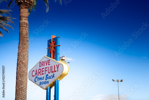 Billede på lærred The back of the 'Welcome to Fabulous Las Vegas' sign reads “Drive Carefully, Come Back Soon,” bidding a friendly farewell to departing visitors under sunny skies