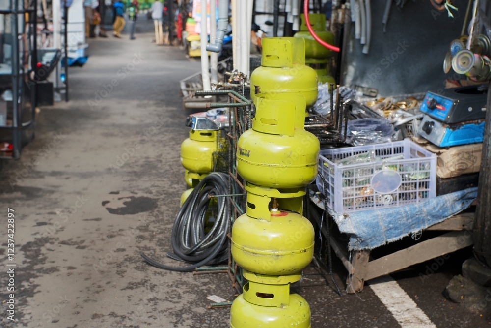 Fototapeta premium Used 3kg Gas Cylinders for Sale at Comboran Scrap Market, Malang City