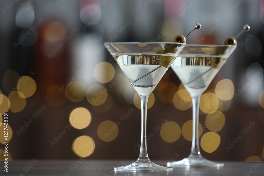 custom made wallpaper toronto digitalMartini cocktail with olives in glasses on wooden table against blurred background, closeup. Bokeh effect