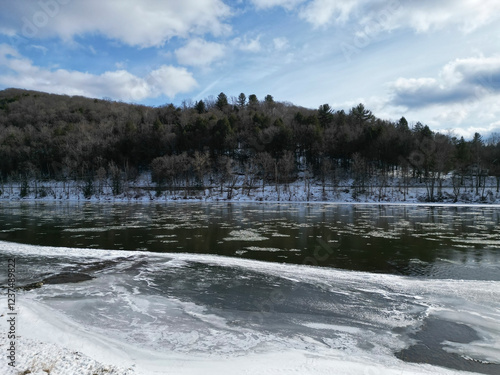 The Allegheny River in Althom, Pennsylvania, USA shot from a drone on a sunny winter day photo