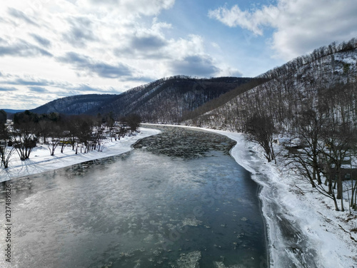 The Allegheny River in Althom, Pennsylvania, USA shot from a drone on a sunny winter day photo