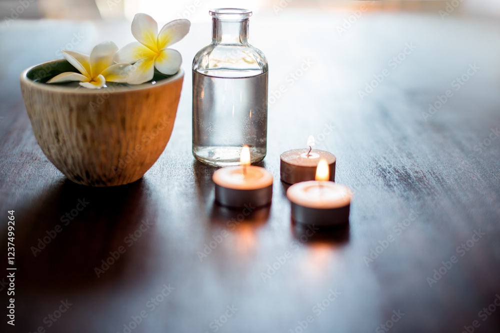 Flower, spa and aromatherapy product on table with candles, peace and natural fragrance. Holistic health, hospitality service and counter with essential oil for self care at luxury wellness salon Flower, spa and aromatherapy product on table with candles, peace and natural fragrance. Holistic health, hospitality service and counter with essential oil for self care at luxury wellness salon