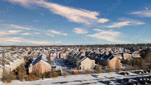 Photos Snow-dusted suburban neighborhood on a sunny winter day.