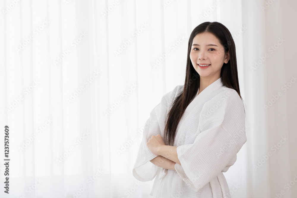 portrait young attractive asian female in white bathrobe standing crossed arms at spa room,woman beauty,health,body care portrait young attractive asian female in white bathrobe standing crossed arms at spa room,woman beauty,health,body care