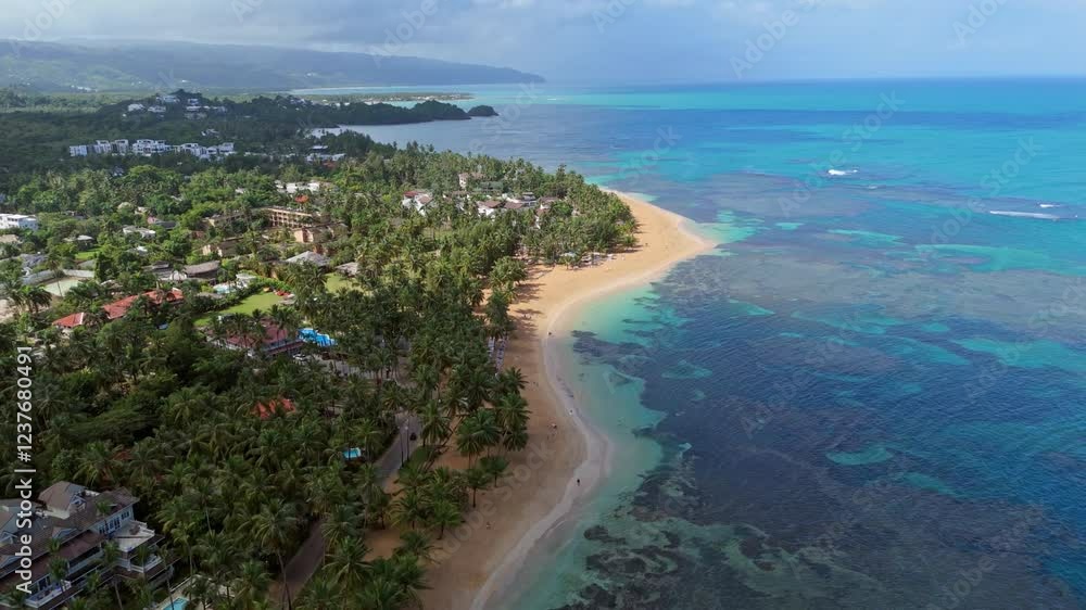 Playa Las Ballenas with golden sands, turquoise waters, and tropical greenery, perfect for travel promotions or nature documentaries, Dominican Republic. Aerial backward Playa Las Ballenas with golden sands, turquoise waters, and tropical greenery, perfect for travel promotions or nature documentaries, Dominican Republic. Aerial backward