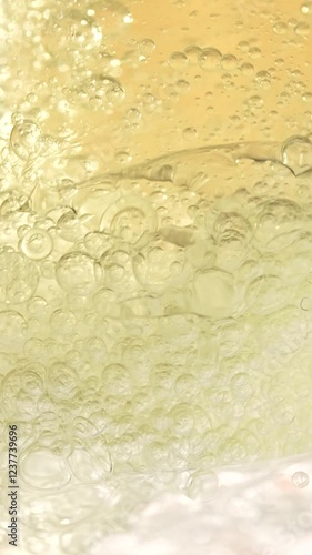 Wallpaper Mural Macro shot of various oil bubbles in water rising up on beige background. Slow motion. Torontodigital.ca