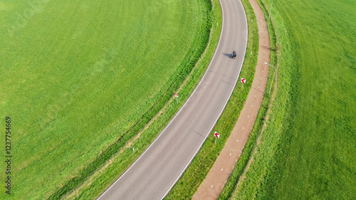 Aerial drone view of asphalt motorway road and bicycle lane from above, transportation infrastructure of the Netherlands photo