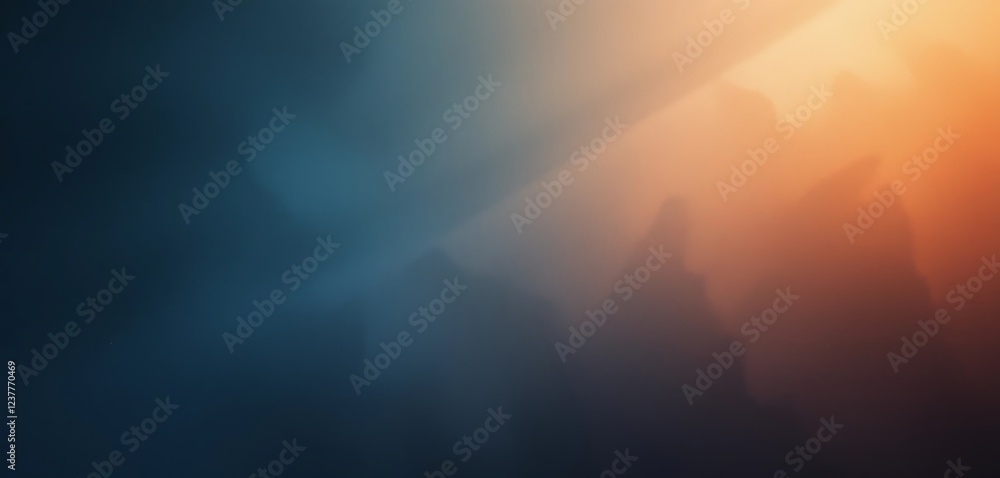 Abstract blurry background with gradient of dark blue and orange colors, featuring soft, out-of-focus shapes resembling mountains or clouds in a misty atmosphere. Abstract blurry background with gradient of dark blue and orange colors, featuring soft, out-of-focus shapes resembling mountains or clouds in a misty atmosphere.