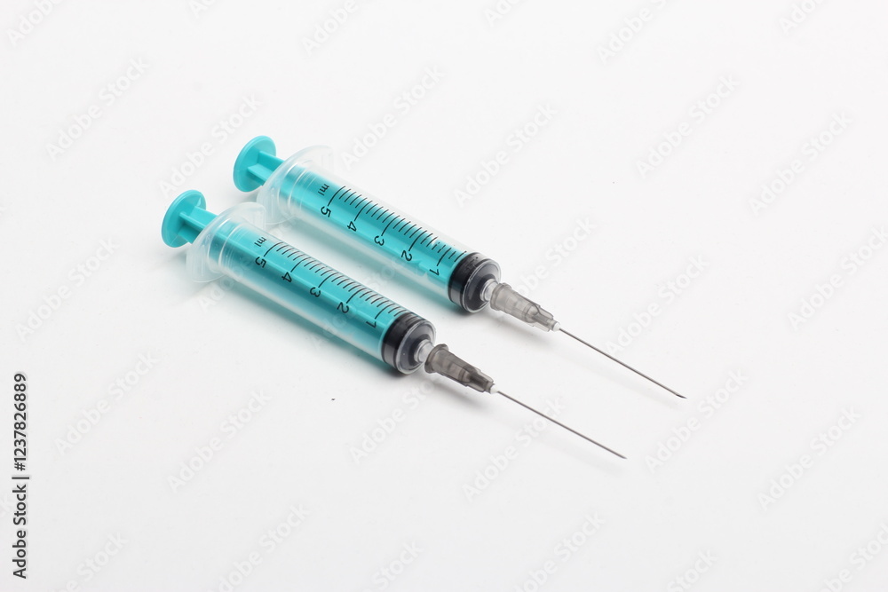 Disposable plastic syringe prepared for injection and vaccination in the hospital. The concept of medicine and health Disposable plastic syringe prepared for injection and vaccination in the hospital. The concept of medicine and health