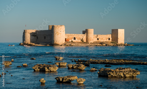 The view of the historical Maiden's Castle ( Turkish; Kız kalesi ) on a beautiful day. Mersin province, Turkey  photo