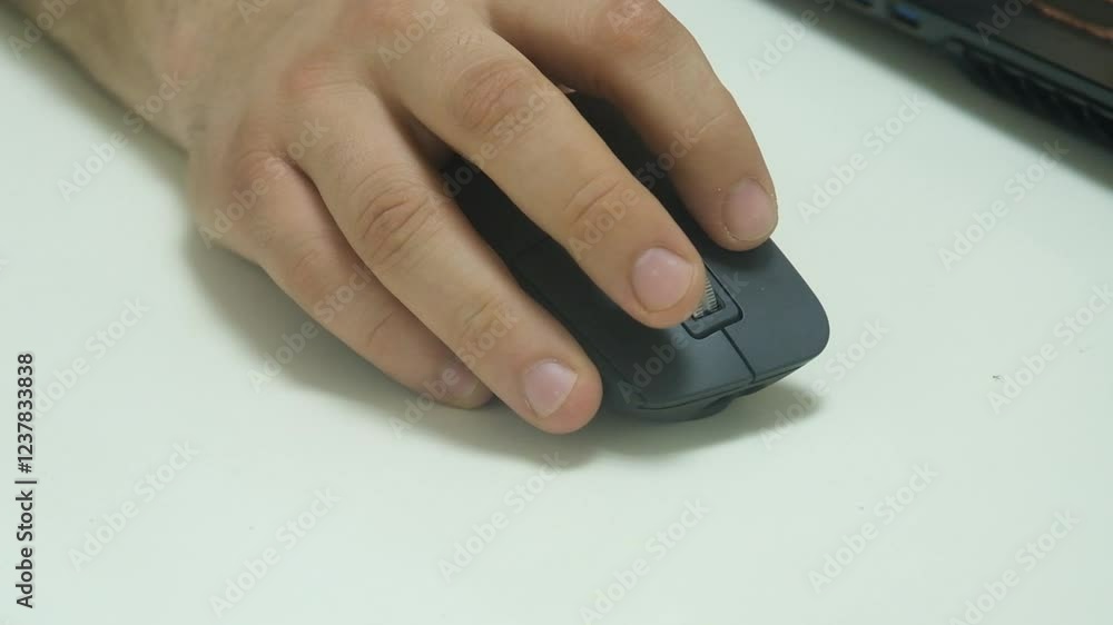 Close up of human hand using mouse for working on computer. Close up of human hand using mouse for working on computer.