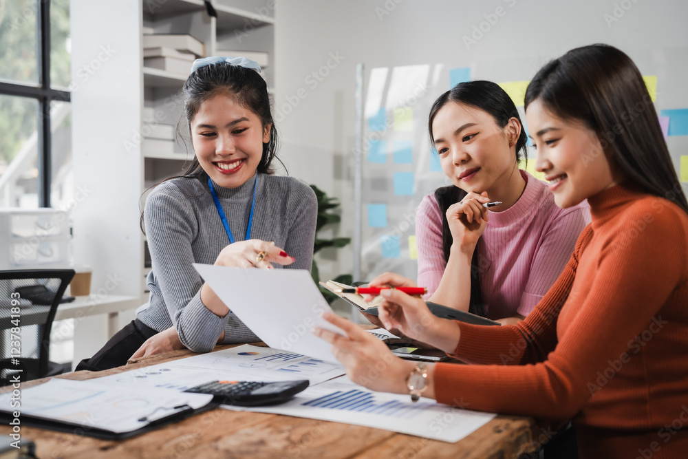 Fototapeta premium Asian people, motivated businesswoman at her desk, brainstorming creative ideas to kickstart her startup venture with determination and innovation. purpose and ambition. only women.
