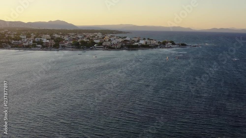 Drone shot of water sports in Artemida, Athens, Greece on a windy day at sunset