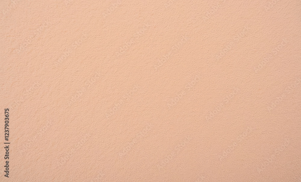 Textured peach wall surface close-up. Textured peach wall surface close-up.