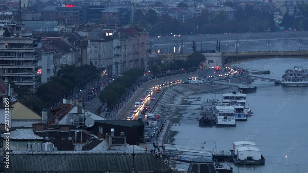 Rush hour traffic in Budapest. View from above to a long line of cars standing on the road because of a traffic jam in Budapest, next to Danube river 4k video Rush hour traffic in Budapest. View from above to a long line of cars standing on the road because of a traffic jam in Budapest, next to Danube river 4k video