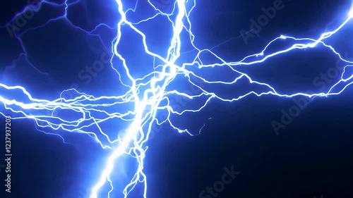 Electric blue lightning strike against night sky