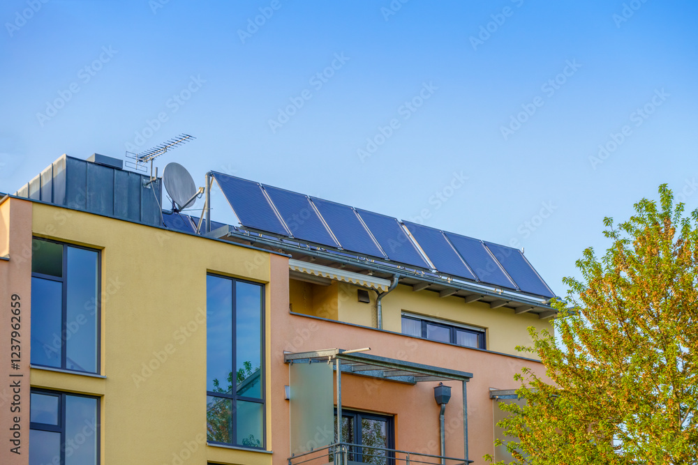 Solar panels installed on roof of house under clear sky Solar panels installed on roof of house under clear sky