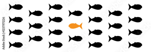 A fish swimming against a crowd of fish in the other direction. A concept showing individual thinking, one's own unimposed personal path and achievements.