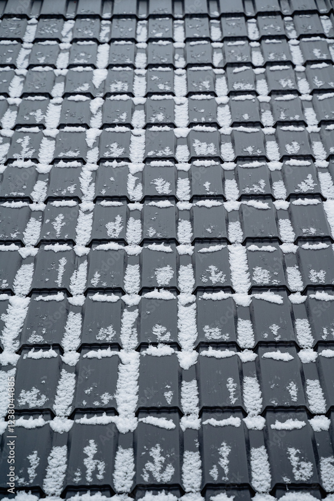 Fototapeta premium This closeup photograph showcases a rooftop blanketed in pristine white snow, creating a breathtaking winter scene that evokes peace and tranquility, representing winters serene beauty