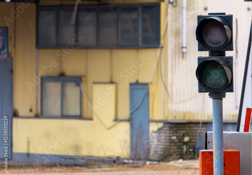 traffic control lights at the entrance gate to an industrial plant. turned off by traffic lights. photo