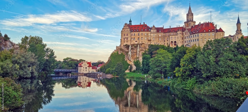 Fototapeta premium Majestic Sigmaringen Castle reflected in the calm river under a blue sky