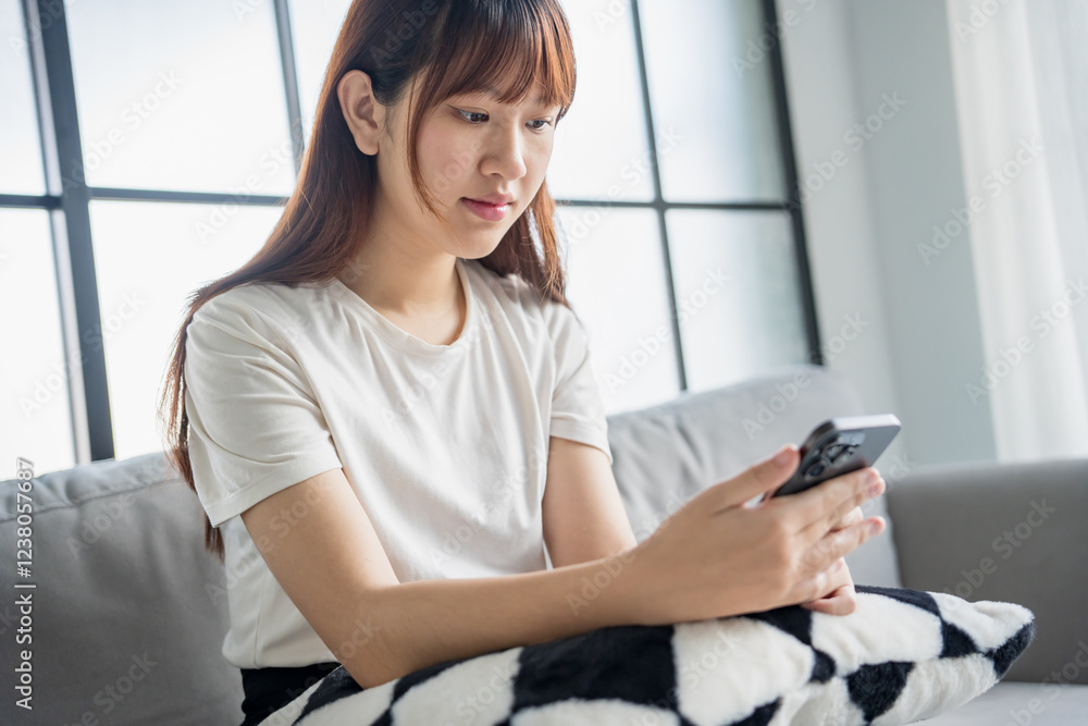 Asian woman using smartphone texting message browsing information Asian woman using smartphone texting message browsing information