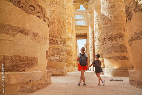 Wallpaper Mural  Egypt - karnak hypostyle hall columns in the temple at luxor thebes and happy tourist girls - mother and daughter on vacation. Torontodigital.ca