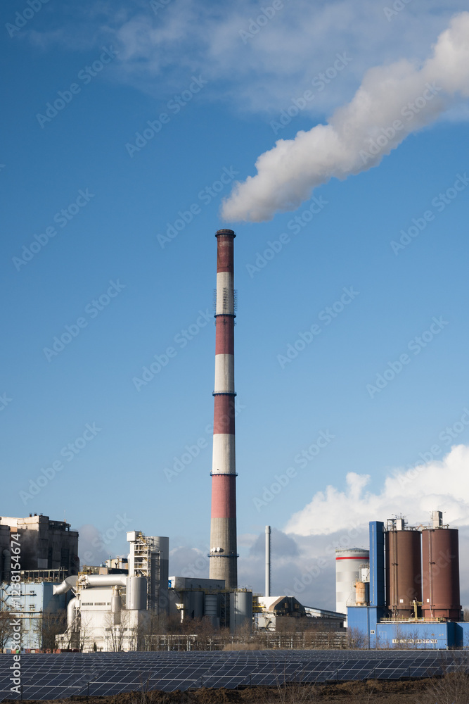 A coal-fired power plant emits greenhouse gases into the atmosphere.