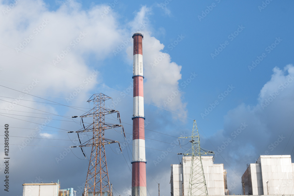 A coal-fired power plant emits greenhouse gases into the atmosphere.