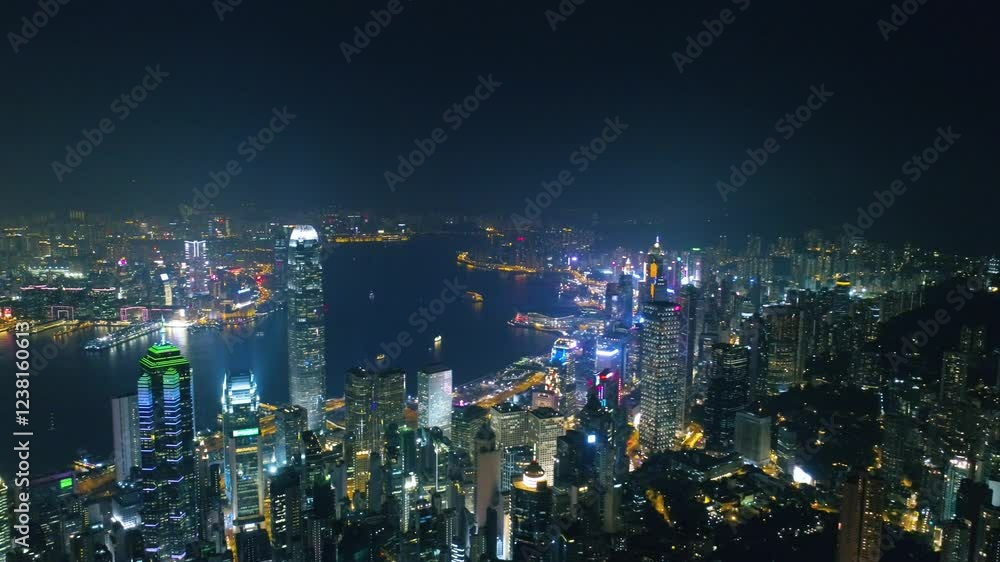 HONG KONG, CHINA - FEBRUARY 2, 2025: A breathtaking aerial view captures the bustling skyline of Hong Kong at night HONG KONG, CHINA - FEBRUARY 2, 2025: A breathtaking aerial view captures the bustling skyline of Hong Kong at night