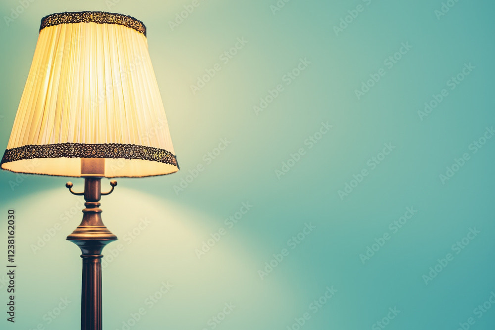 Illuminated Table Lamp Against Teal Wall. Illuminated Table Lamp Against Teal Wall.