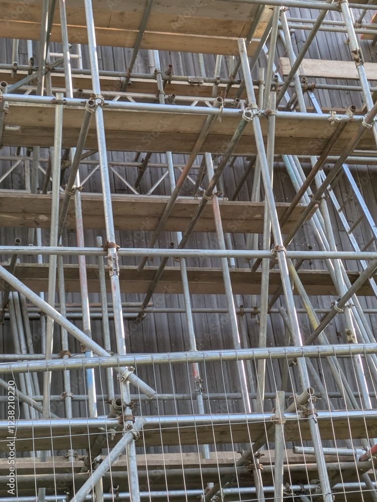 Large Industrial Building Covered and Surrounded with Scaffolding Large Industrial Building Covered and Surrounded with Scaffolding