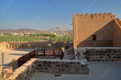 The impressive Jabreen fort in Bahla, Al Dakhiliyah, Oman, with the surrounding countryside and mountains photo