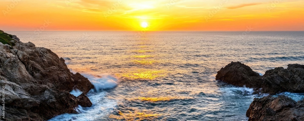 Obraz premium Sunset over ocean waves nature idea. Breathtaking sunset over the ocean, illuminating the tranquil waters and rocky shore.