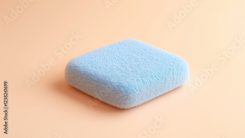 A white and grey object with a rough texture sits on a light colored surface