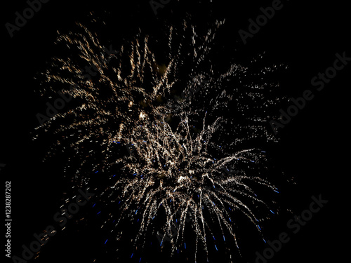 Colorful fireworks of various colors over night sky. Celebration Happy New Year