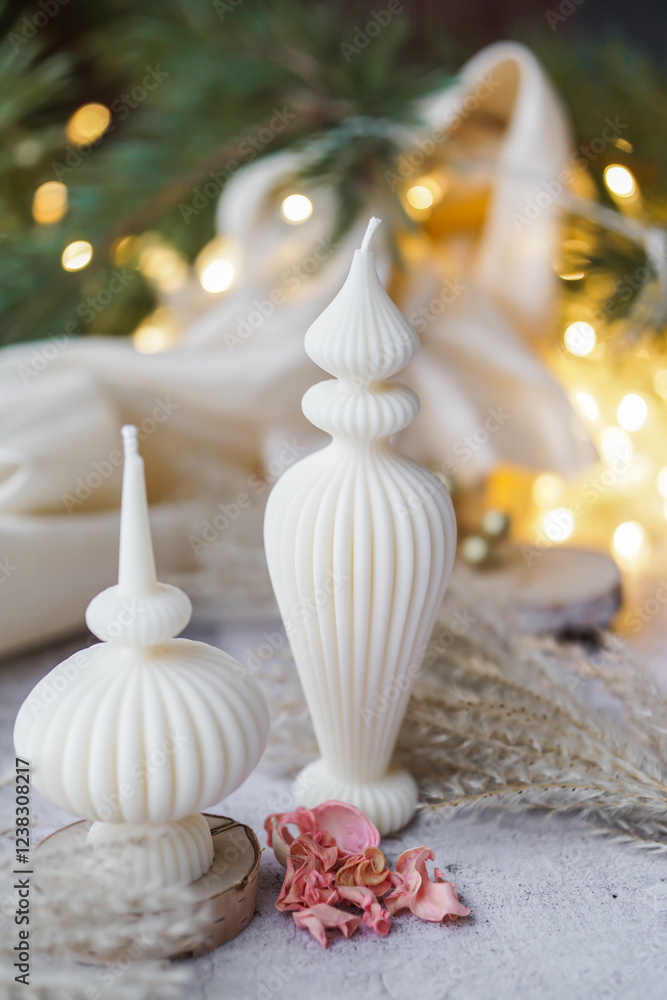 Obraz premium Luxurious handmade soy wax candle in cozy room, Christmas lights in the background
