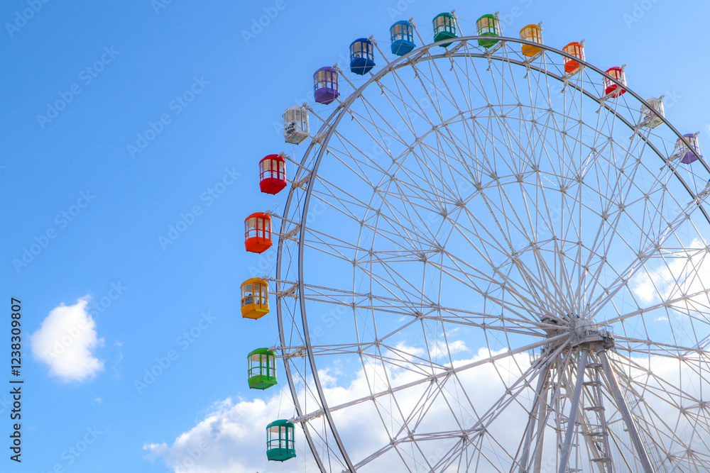 Colourful ferris wheel against a blue sky. Colourful ferris wheel against a blue sky.