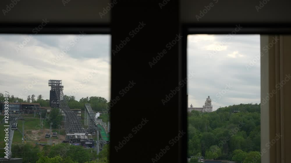View of the main building of Moscow State University from the park in the summer . Dolly camera View of the main building of Moscow State University from the park in the summer . Dolly camera