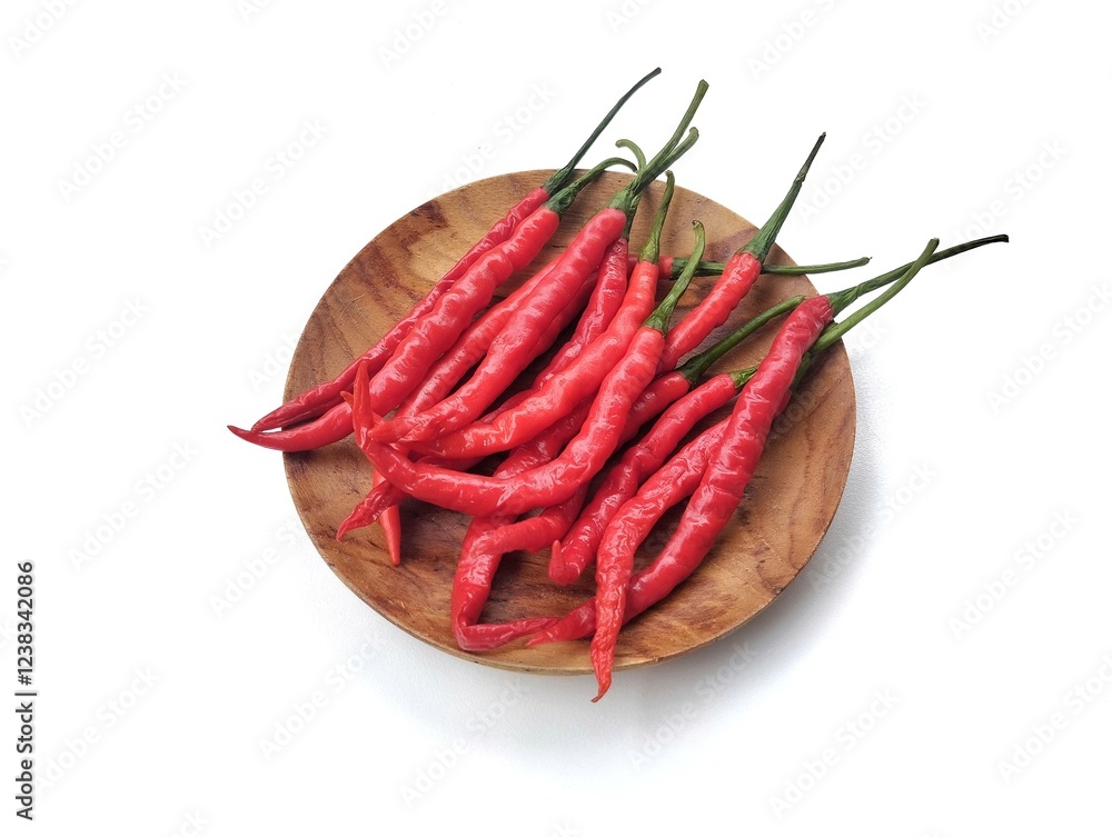 Fresh red hot chili peppers on plate isolated on white background Fresh red hot chili peppers on plate isolated on white background