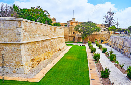 The park in moat of Mdina fortress and St Peter's Bastion, Malta photo