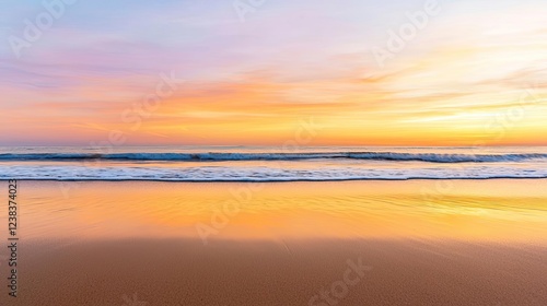 Sunset over ocean nature concept. A serene beach at sunset, with golden sands and gentle waves under a colorful sky.