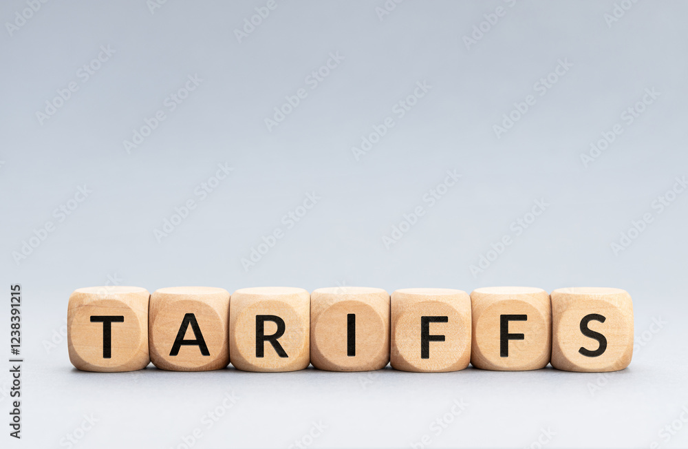 TARIFFS word on wooden blocks isolated on gray background. Copy space TARIFFS word on wooden blocks isolated on gray background. Copy space