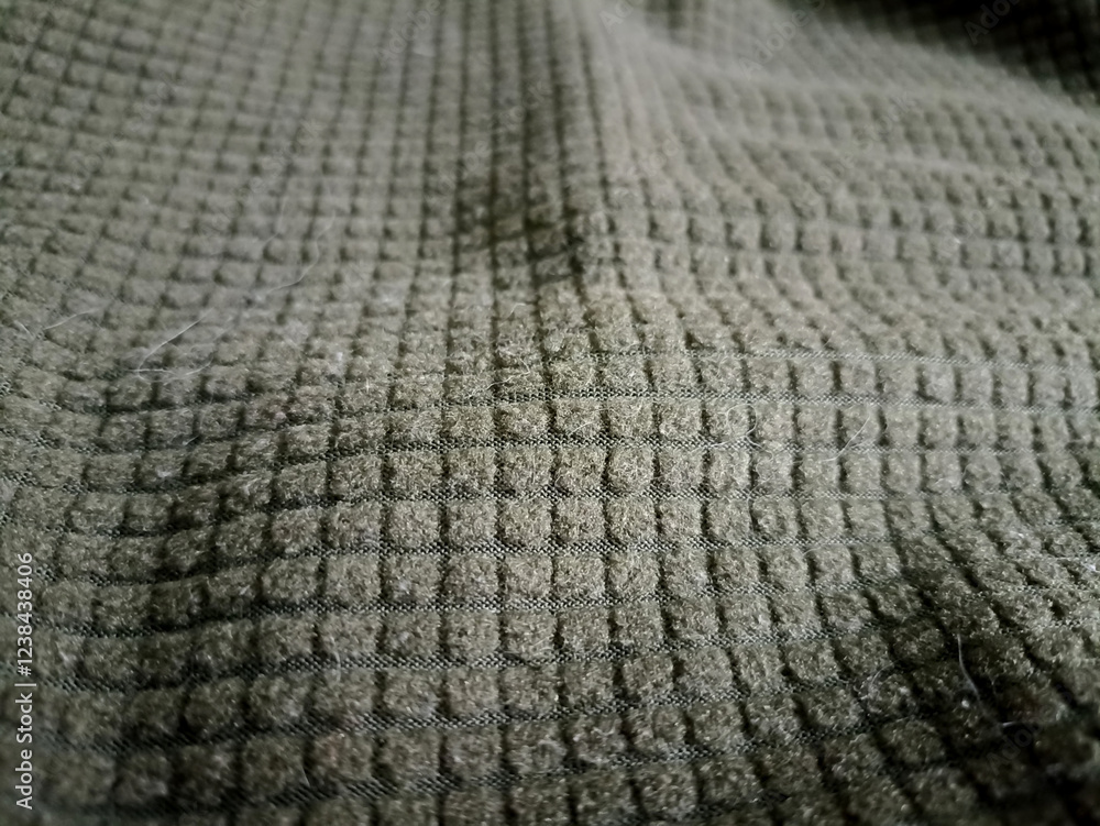 Dark green thermal fabric. The military Close up. Dark green thermal fabric. The military Close up.
