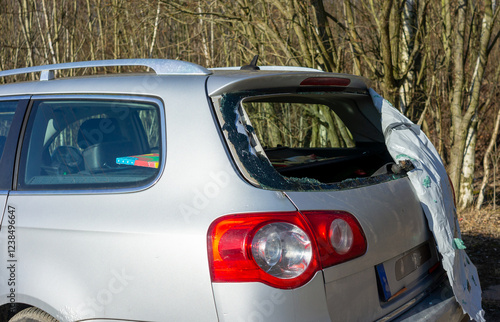 Rear window of a car smashed due to vandalism photo