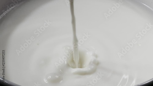 Wallpaper Mural Milk drop falling and splashing; leaving beautiful round ripples on the milk surface. Slow motion close up video. Torontodigital.ca