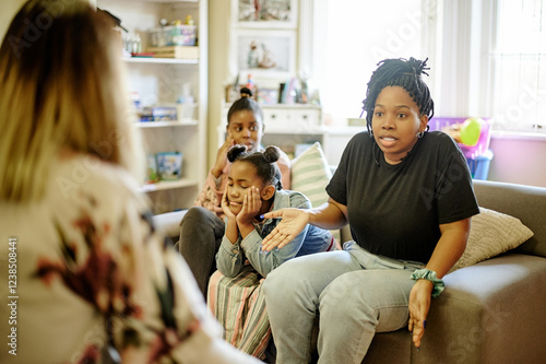 Obraz na płótnie Stress, therapy and mother with children in counseling session, consulting and help for parenting. Psychology, black family and upset mom talking to therapist with problem, divorce and frustrated w salonie