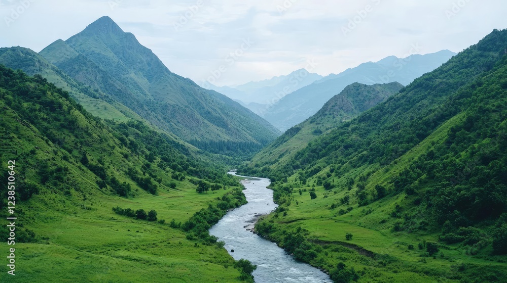 Fototapeta premium Amidst mountains nature idea. A serene river flows through lush, green mountains under a cloudy sky.