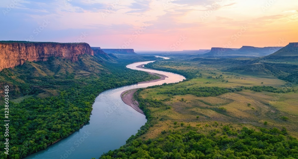 River canyon nature idea. Stunning aerial view of a river winding through lush green valleys and majestic cliffs. River canyon nature idea. Stunning aerial view of a river winding through lush green valleys and majestic cliffs.